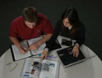 Two students sitting at a round table